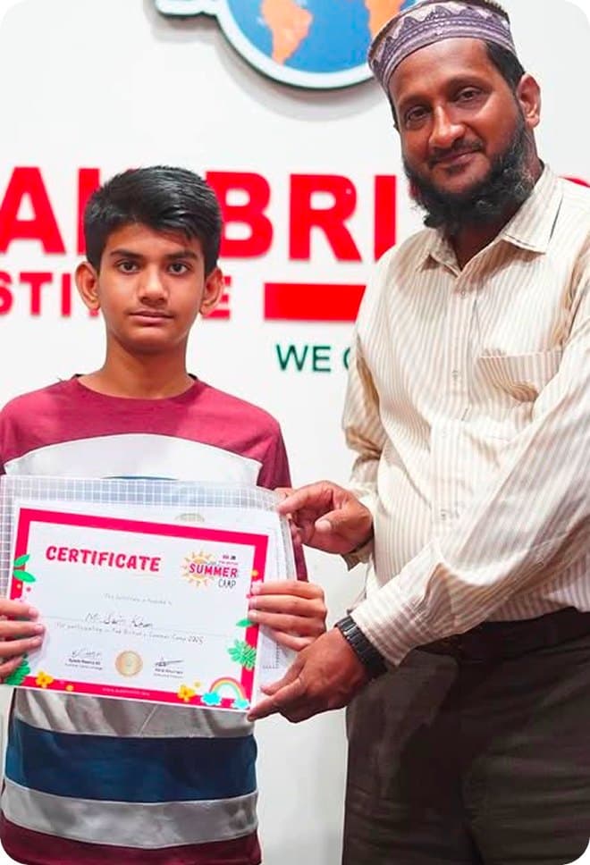 A student holding a certificate at the Pak British Institute